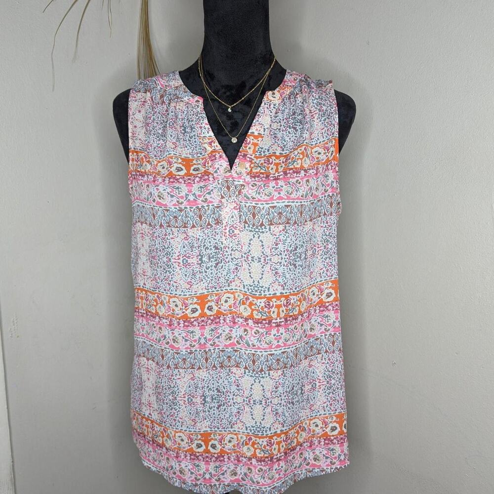 White and orange sleeveless top
